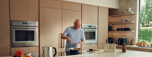 Andre Agassi shows off what he can do in the kitchen